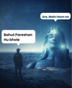 a person standing on a hill looking at a statue of a mahadev