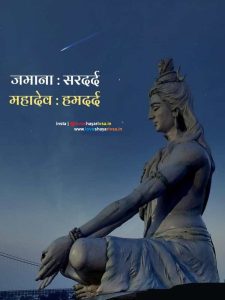 a statue of a person sitting on a rock