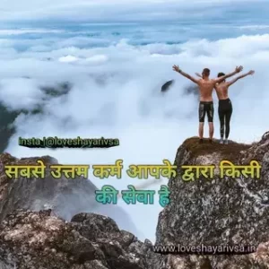 two people standing on a cliff with their arms raised